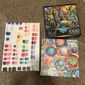Three 1000 piece jigsaw puzzles